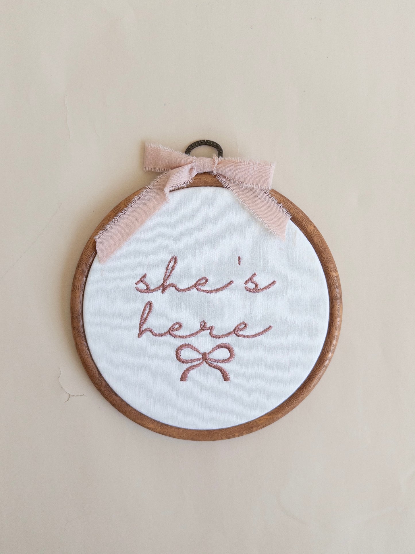 She's Here Embroidered Hoop Sign